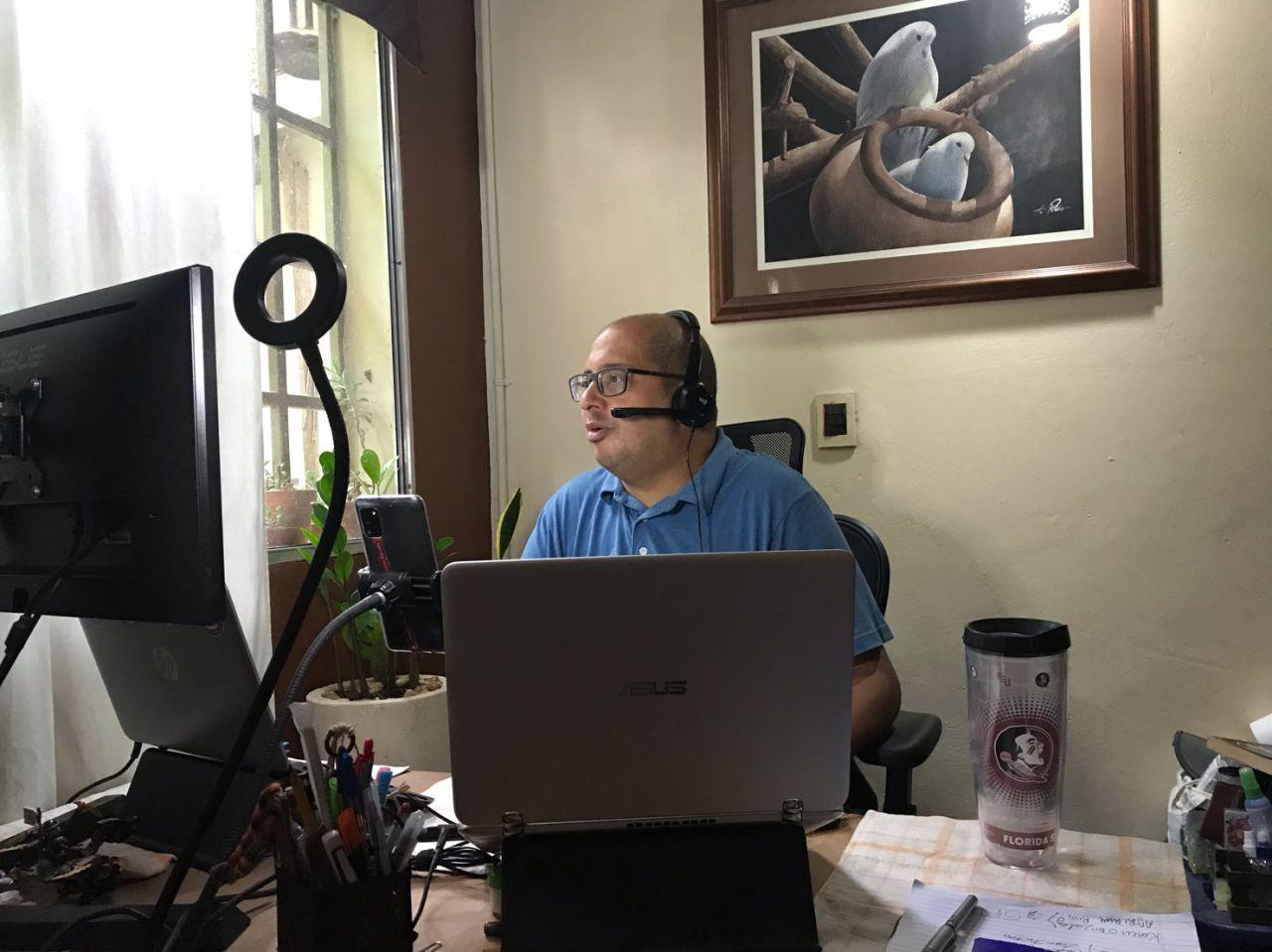 Carlos Espinosa leading a remote coaching session from his home office